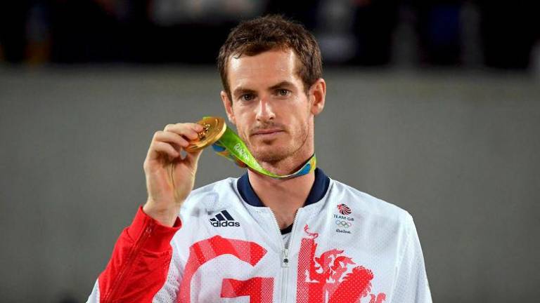 Gold medalist Andy Murray (GBR) of Britain reacts after receiving his medal in 2016 Rio Olympics - REUTERSpix