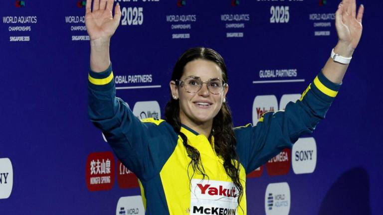 Swimming - World Aquatics Championships - Women's 200m Backstroke Final - World Aquatics Championships Arena, Singapore - August 2, 2025Gold medallist Australia's Kaylee McKeown celebrates after winning the Women's 200m Backstroke Final - REUTERSPIX