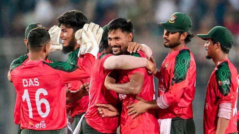 Bangladesh's players celebrate their team's win at the end of the second Twenty20 international cricket match between Bangladesh and Pakistan at the Sher-e-Bangla National Cricket Stadium in Dhaka on July 22, 2025. - AFPPIX