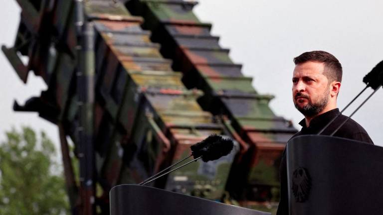 Ukrainian President Volodymyr Zelenskiy looks on during a visit to a military training area to find out about the training of Ukrainian soldiers on the Patriot missile system, at an undisclosed location in Germany, June 11, 2024. - REUTERSPIX