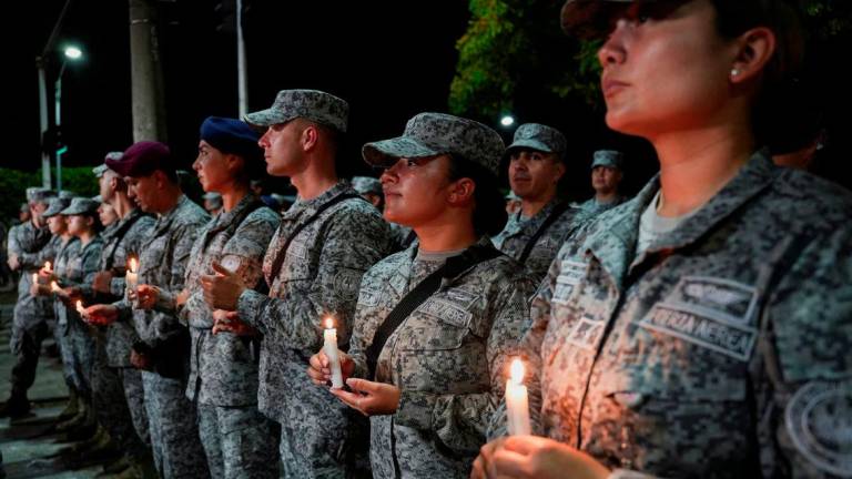 Colombian Armed Forces members take part in a candlelight vigil in honor of victims of a cargo vehicle bomb attack near the Colombia Aerospace base, attributed to FARC dissident groups, that caused multiple casualties, in Cali, Colombia, August 24, 2025. - REUTERSPIX