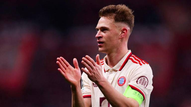 Football - Champions League - Round of 16 - Second Leg - Bayer Leverkusen v Bayern Munich - BayArena, Leverkusen, Germany - March 11, 2025Bayern Munich's Joshua Kimmich celebrates after winning the match - REUTERSPIX