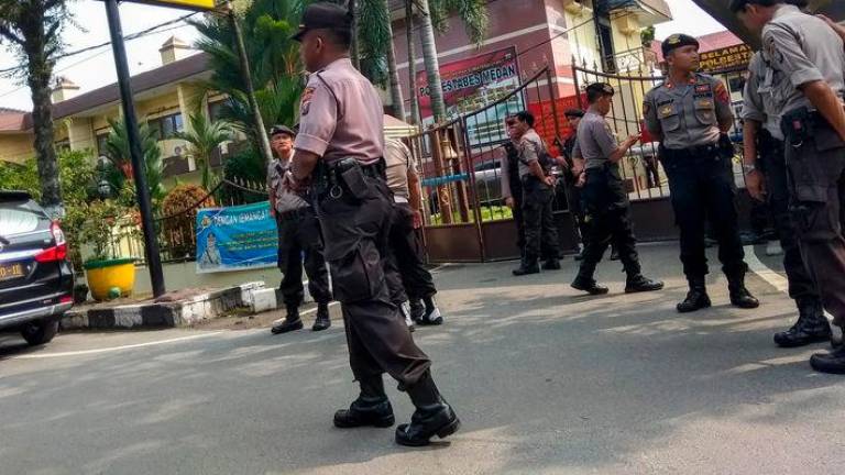 The West Sumatra police said they have questioned 39 officers so far and have not received reports of abuse - AFPpix