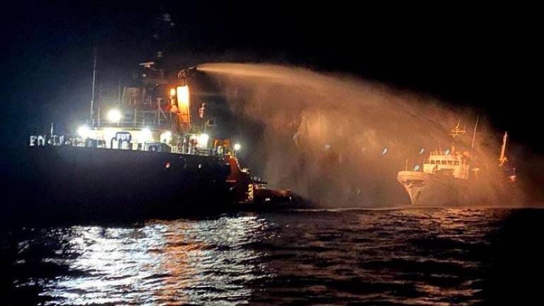 A tug vessel puts out a fire on the Gaza Freedom Flotilla vessel Conscience outside Maltese territorial waters in this handout picture provided by Malta Government Department of Information, May 2, 2025. - REUTERSPIX