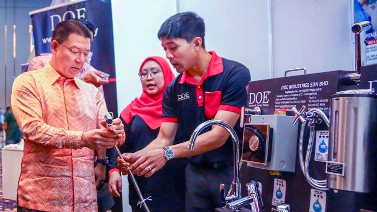 Nga being briefed on a range of products on display at the event, which was held at the Bangi Avenue Convention Center. – ADAM AMIR HAMZAH/THESUN