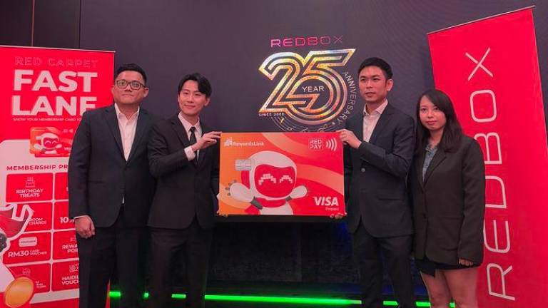 (From left to right) Red Box Group CEO Karl Khoo; Red Box Group General Manager Terry Swee; TOGL Technology Chief Marketing Officer Calvert Choo; RewardsLink Business Development Manager Alice Lua.