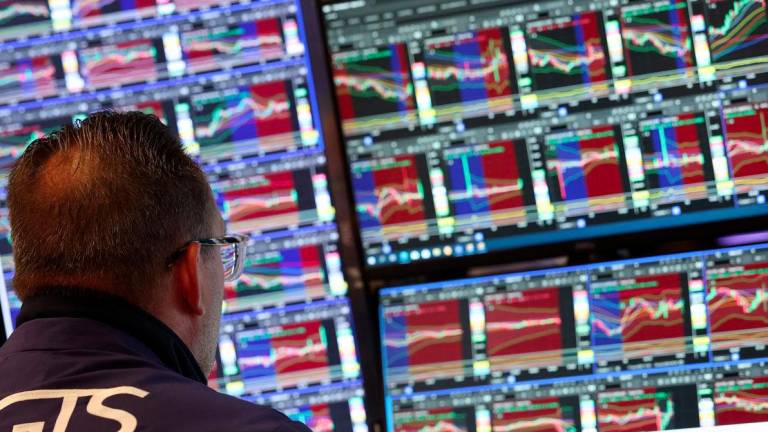 Traders work on the floor of the New York Stock Exchange (NYSE) at the in New York City on June 18, 2025. - AFPPIX