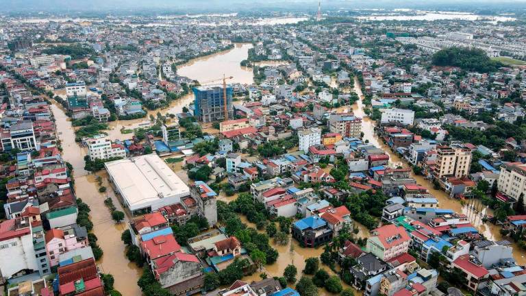 Floodwaters inundating residential areas after heavy rains brought by Typhoon Matmo in Thai Nguyen city on October 8, 2025. (Photo by AFP)