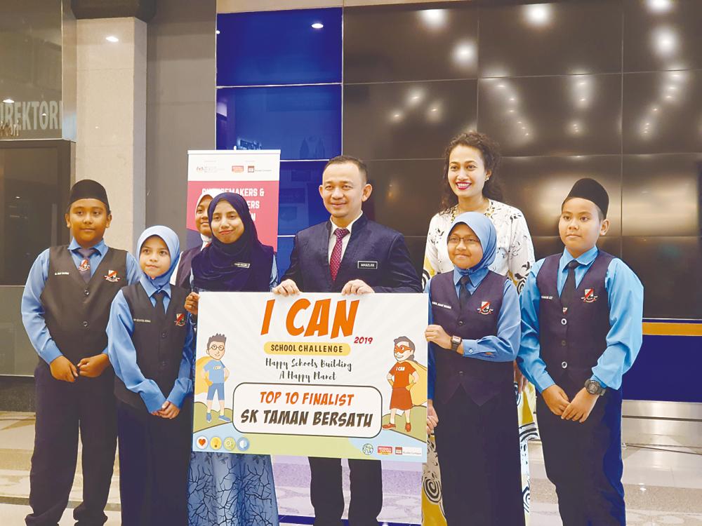 THE BRIGHTEST ... Out of 94 participating teams, 10 teams emerged as winners of the ICAN School Challenge 2019. The students, aged between six to 16 years old, and their teams will represent Malaysia for this year’s global ICAN Children’s Summit in Italy that is expected to host 2,000 children and 800 educators. Education Minister Dr Maszlee Malik is seen here with the students of SK Taman Bersatu.
