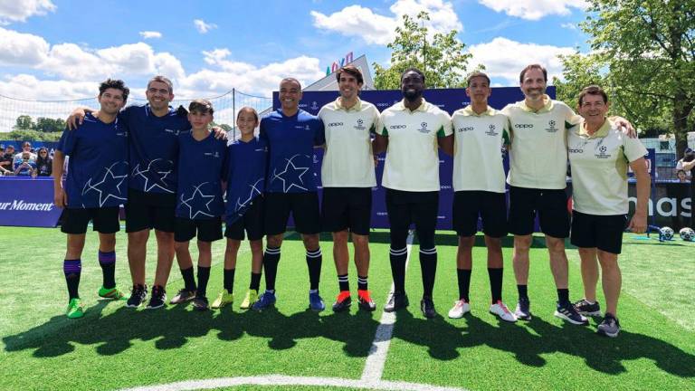 Uefa legends pose for photos after a friendly game with young players from Brazil.