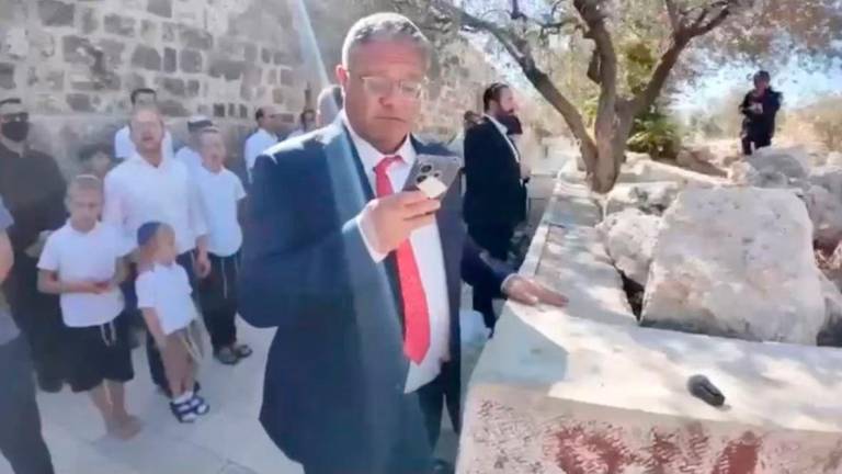 Israeli National Security Minister Itamar Ben-Gvir prays at the Al-Aqsa Mosque compound during the Jewish holiday of Sukkot, in the Old City of Jerusalem, in this screengrab from a video obtained by Reuters on October 8, 2025. Jewish Power/Handout via REUTERS