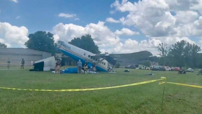 This handout screengrab courtesy of the X account of Tennessee Highway Patrol shows troopers and police cars at the scene of a plane crash on Old Shelbyville Road in Tullahoma, Tennessee on June 8, 2025. AFPpix
