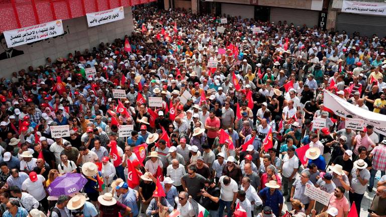 Members of the Tunisian General Labour Union (UGTT) demonstrate after earlier this month President Kais Saied’s supporters staged a rally outside UGTT headquarters, urging Saied to suspend the union following a transport strike, in Tunis, Tunisia August 21, 2025. - REUTERS/Jihed Abidellaoui