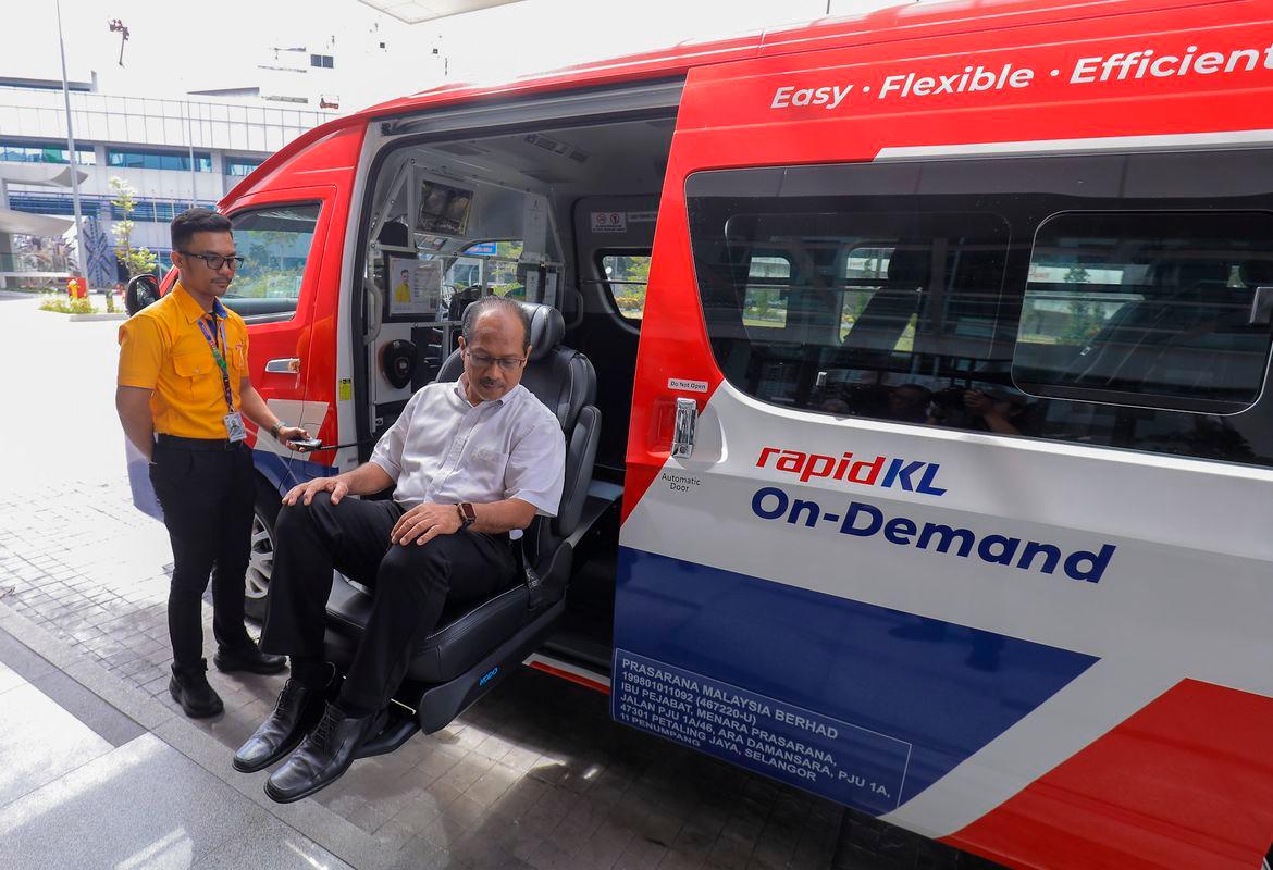 Ku Jamil demonstrating the use of a special seat for wheelchair users and disabled persons. – ADIB RAWI YAHYA/THESUN