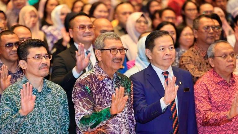 Director-General of Public Service (KPPA) Tan Sri Wan Ahmad Dahlan Abdul Aziz (second left). - BERNAMA