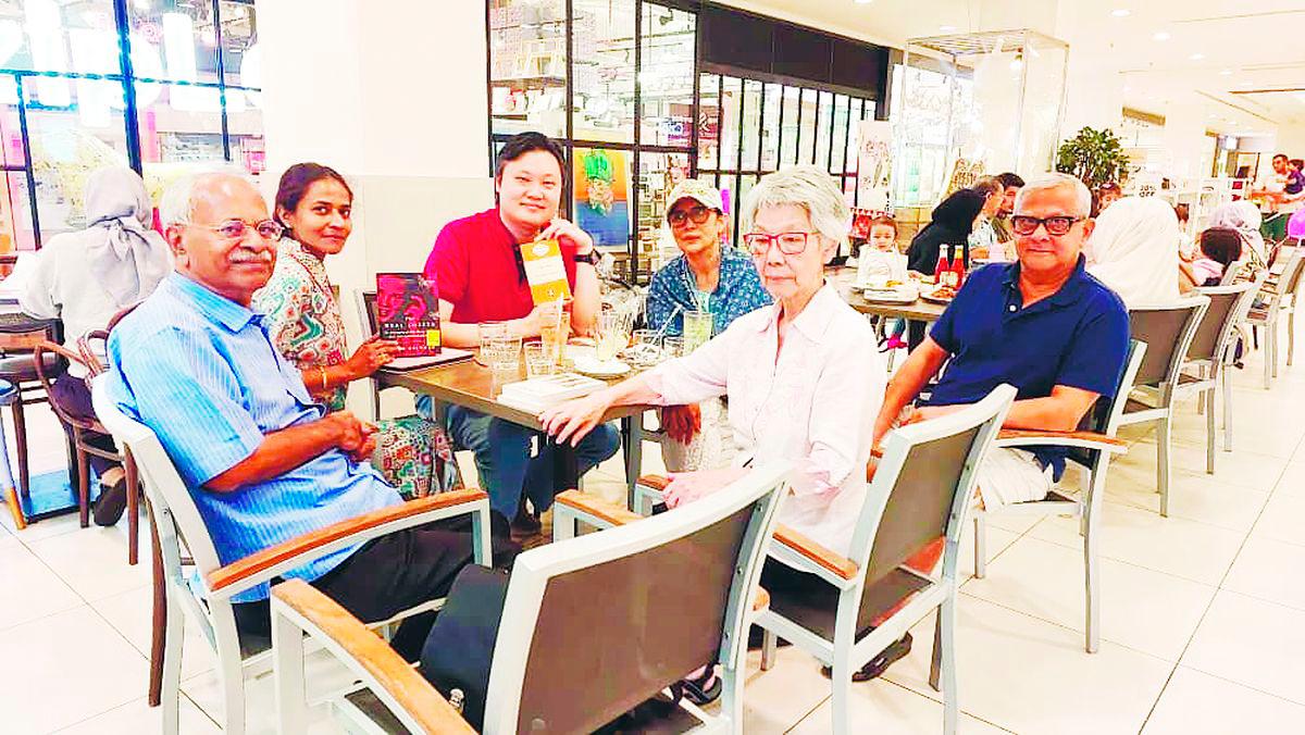 $!Naz’s (fourth from left) book club meets regularly to discuss ’classic’ books of interest.