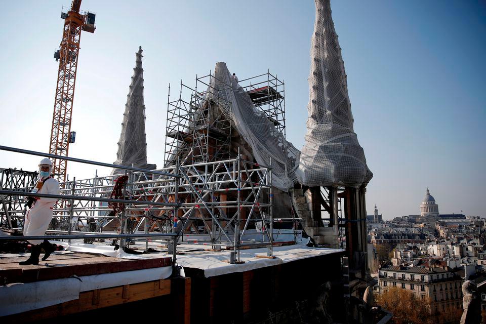 A view shows the reconstruction site of the roof of the Notre-Dame de Paris Cathedral, which was damaged in a devastating fire two years ago, as restoration works continue, in Paris, France, April 15, 2021. REUTERSPIX