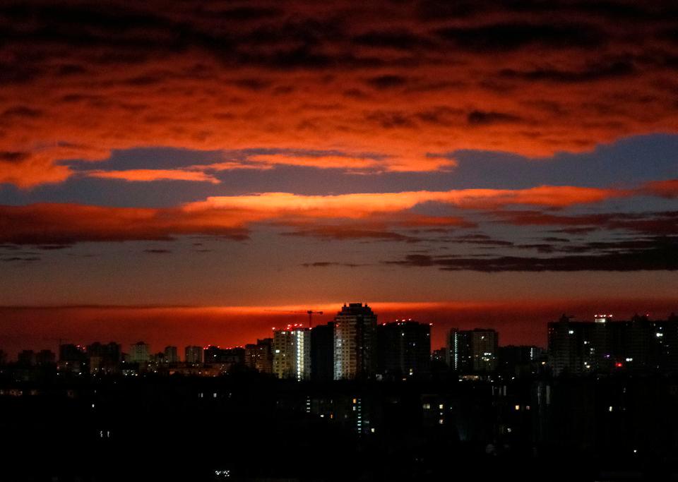 A glow is seen over the city’s skyline during a shelling, following Russia’s invasion of Ukraine, in Kyiv, Ukraine February 28, 2022. REUTERSPIX