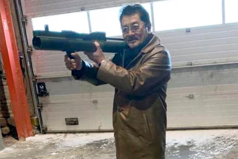 Takeshi Ebisawa poses with a rocket launcher at a warehouse in Copenhagen, Denmark - REUTERSpix