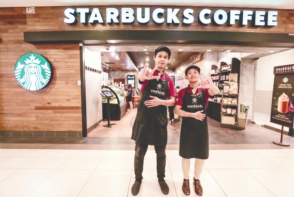 Muhammad Aizad (left) and Mohd Akmal at Starbucks Bangsar Village II.