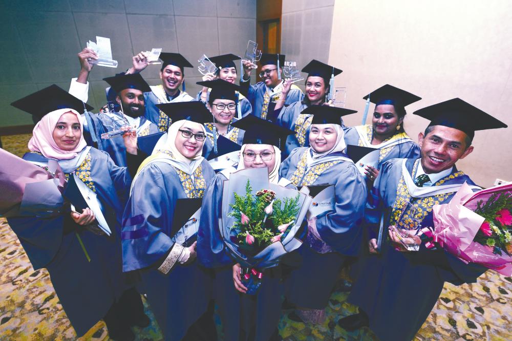 UNITAR International University graduates celebrating their convocation.