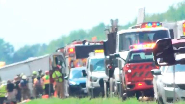 Images of rescuers at the site where a bus crashed on the Interstate 90 highway in New York state. - AFP