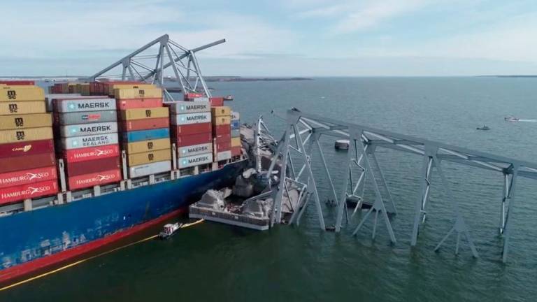 A drone view of the Dali cargo vessel, which crashed into the Francis Scott Key Bridge causing it to collapse, in Baltimore, Maryland, U.S., March 26, 2024, in this still image taken from a handout video. - REUTERSPIX