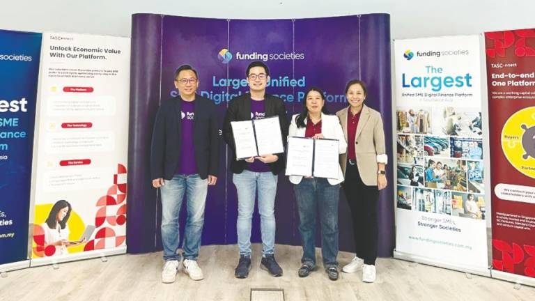 From left: Funding Societies sales and key account head Sean Hor, Chai, Ang and TASConnect (Malaysia) chief business officer Chan Tse Ning at the signing ceremony.