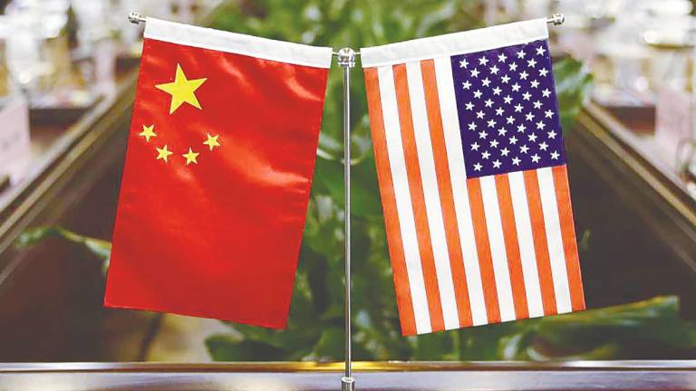 Beijing and Washington reaffirm trade commitments, with China set to review export approvals and the US to lift select measures. – AFPPIX