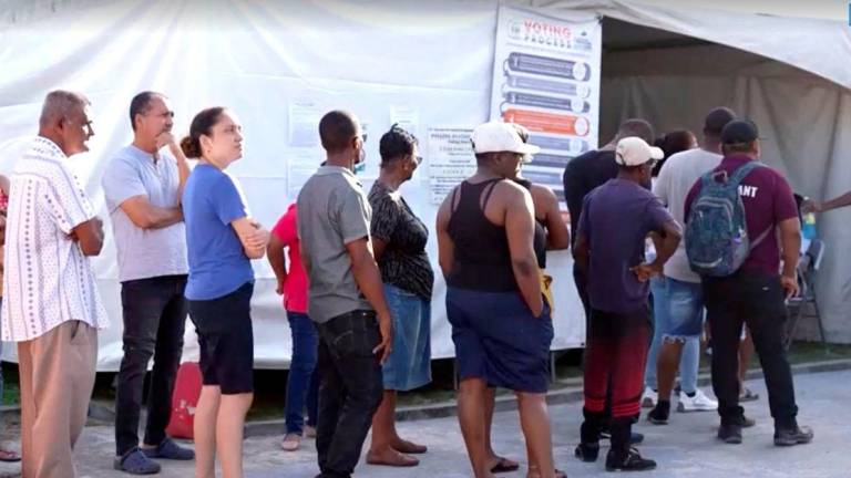 People wait to cast their vote during the general election in Georgetown, Guyana, September 1, 2025, in this screen grab taken from a video. - Reuters TV/via REUTERSPIX