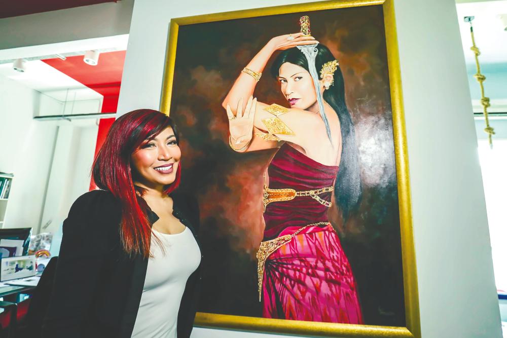 Tiara with her portrait of Puteri Gunung Ledang. - ADIB RAWI/THESUN