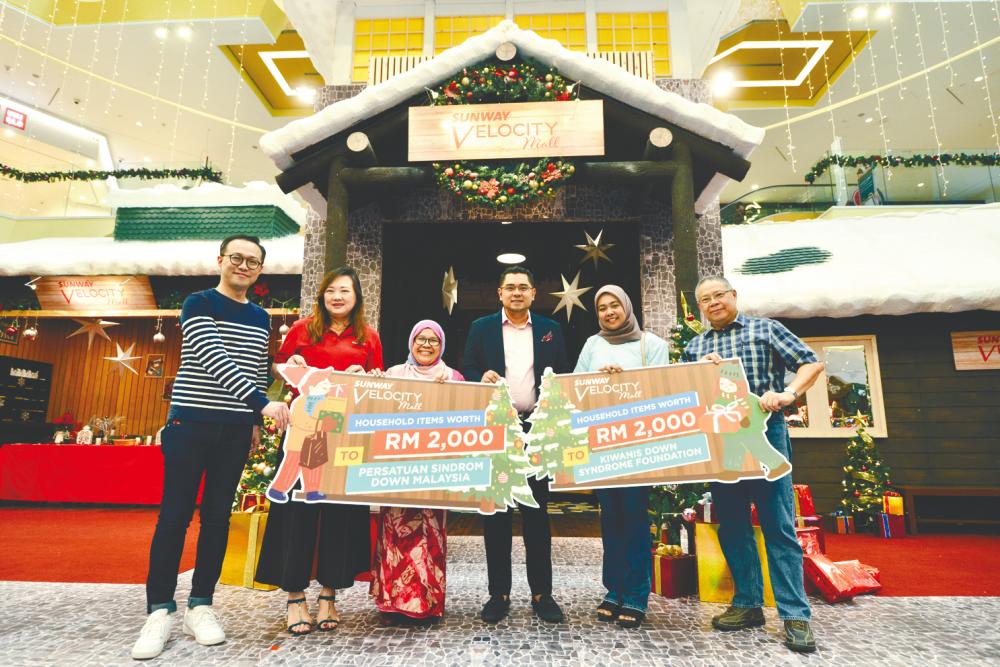 Sunway Velocity Mall donated a total of RM4,000 worth of household goods to two Down Syndrome organisations.