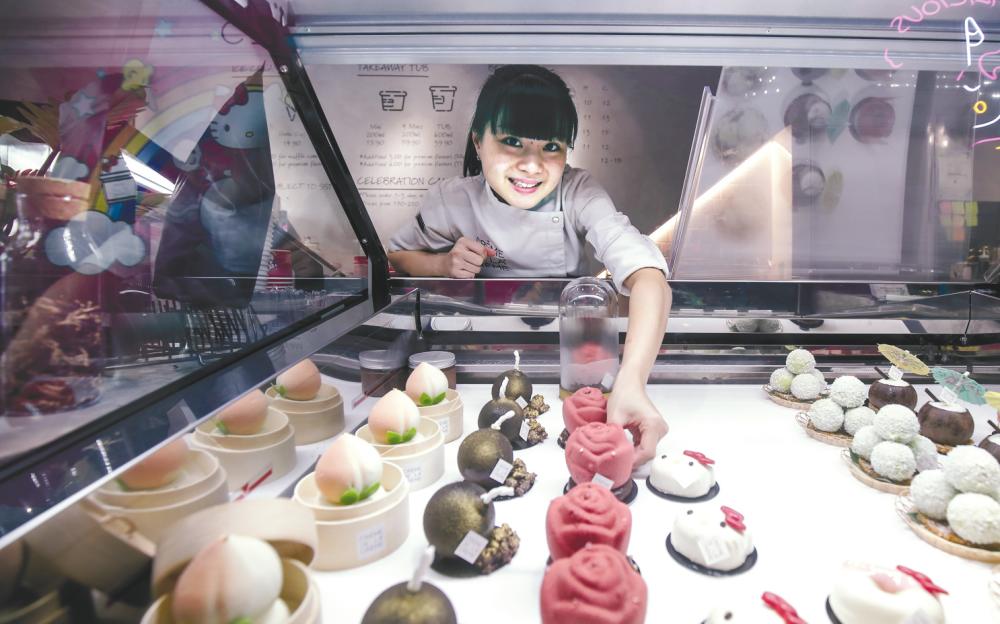 Chung with some of the current ice cream creations she and her team whipped up at Creme De La Creme. – AMIRUL SYAFIQ MOHD DIN/THESUN