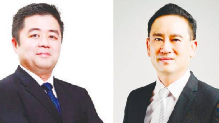 Gan (left) says Radium Development will contribute meaningfully to affordable housing landscape and Neoh says Trinity Group will work with government and industry peers.