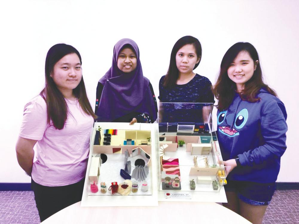 Team ‘Capture It’ with lecturer Sheau Huey (third from left) presenting their wedding planning business model.