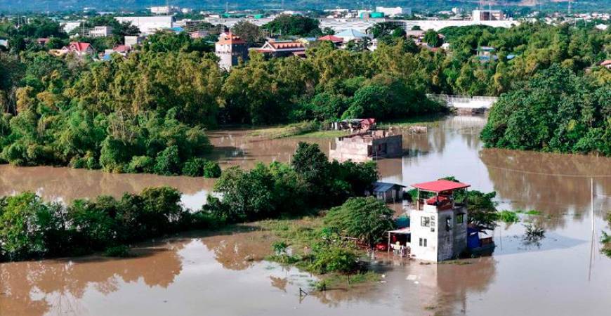 This aerial photo shows a flooded area due to the heavy rains brought about by Tropical Storm Trami in Tuguegarao City, province of Cagayan on October 25, 2024. - AFPPIX