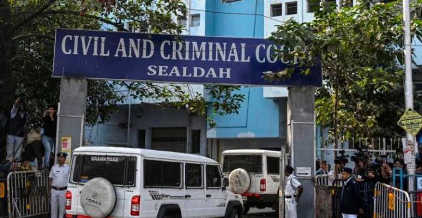 Police personnel stand guard at the entrance of the Civil and Criminal Court Sealdah in Kolkata - AFPpix