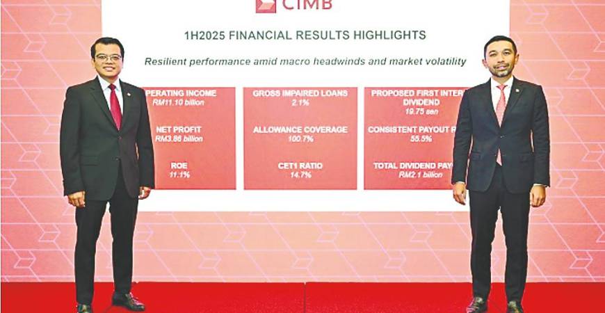 Novan (right) and chief financial and strategy officer Khairul Rifaie at CIMB Group’s first-half financial results press conference today.