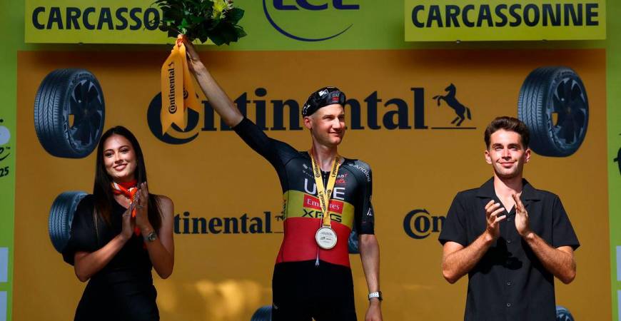 UAE Team Emirates XRG’s Tim Wellens celebrates on the podium after winning stage 15 REUTERS