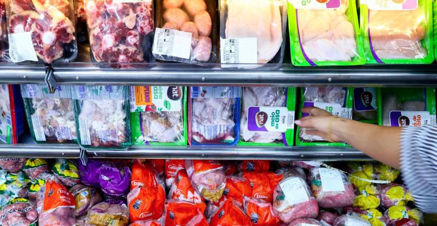 A consumer buys chicken at a local market, in Montenegro, Brazil May 17, 2025. - REUTERSPIX