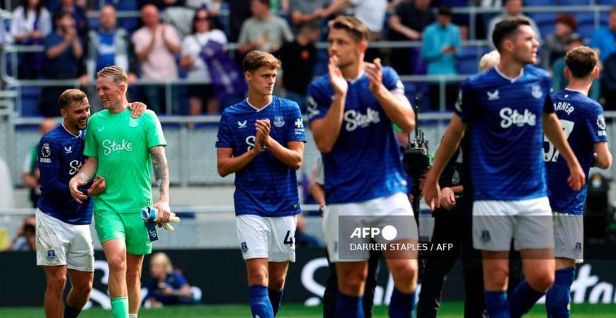 Everton's English midfielder #22 Kiernan Dewsbury-Hall (L) jokes with Everton's English goalkeeper #01 Jordan Pickford after the English Premier League football match between Everton and Brighton and Hove Albion at Hill Dickinson Stadium in Liverpool, north west England on August 24, 2025. - AFP