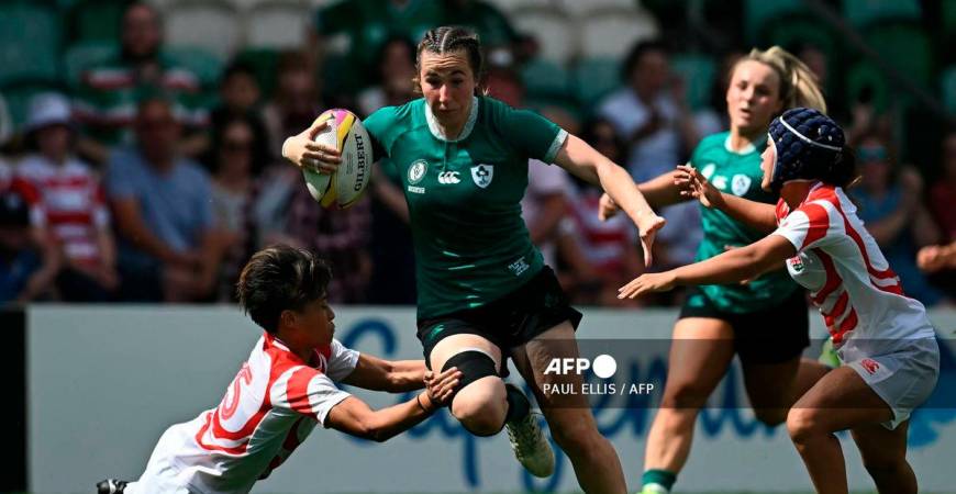 Ireland's centre Eve Higgins (C) breaks through Japan's defence to set up the team's fourth try during the Women’s Rugby World Cup pool C match between Ireland and Japan at Franklin's Gardens in Northampton, central England, on August 24, 2025. - AFP