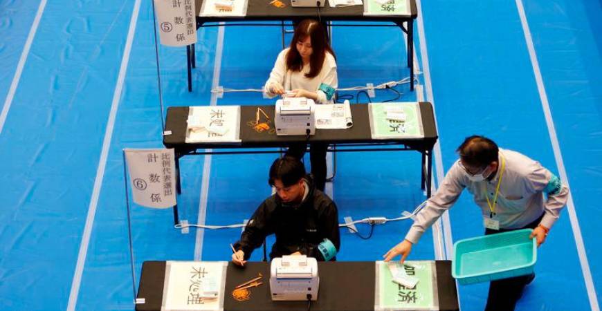 Election officers count ballots for the general election at a ballot counting centre in Tokyo, Japan October 27, 2024. - REUTERSPIX