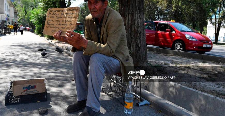 A man asks for donation for medicines in Bishkek, on July 23, 2025. Like many people affected by serious illness in ex-Soviet Central Asia, Almagul Ibrayeva is having trouble finding medicine in her native Kyrgyzstan. The shortages, the high prices and the poor quality of medicine affect many of the region's 80 million inhabitants. - VYACHESLAV OSELEDKO / AFP