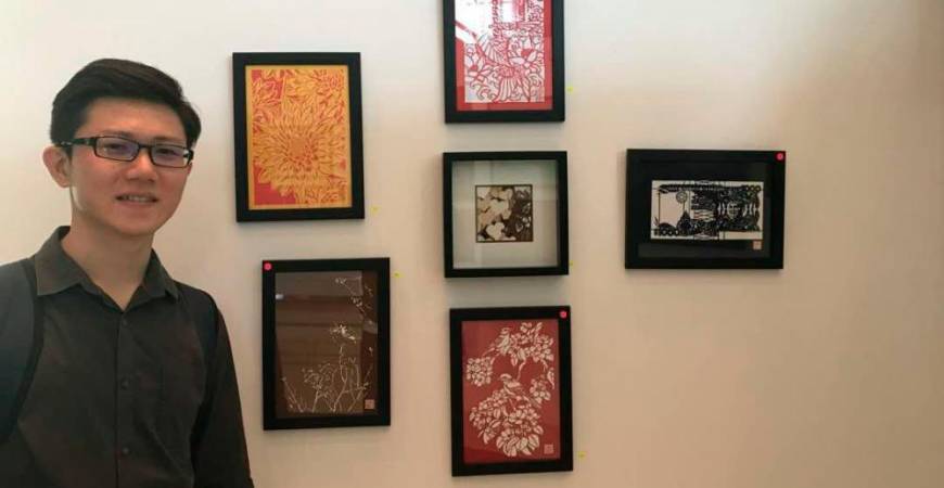 Chong with his artworks during an exhibition at Bank Negara Malaysia. – COURTESY OF CHONG KAI ZEN