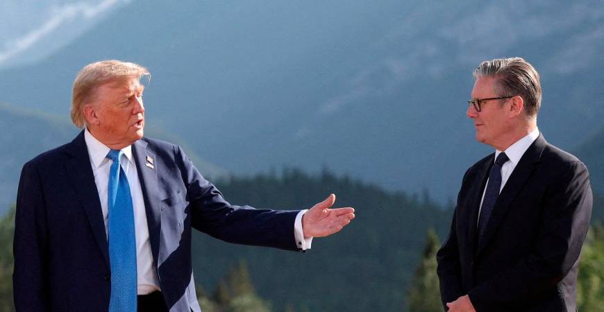 U.S. President Donald Trump and British Prime Minister Keir Starmer attend a photo session during the G7 Summit, in Kananaskis, Alberta, Canada, June 16, 2025. - REUTERS/Suzanne Plunkett/Pool/File Photo