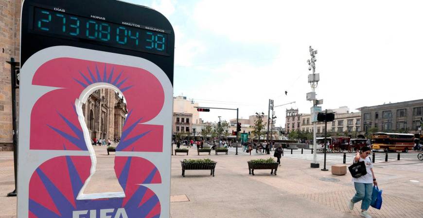 A woman walks past the FIFA World Cup 2026 countdown clock in Guadalajara, Jalisco state, Mexico on September 10, 2025. Registration is now open to participate in the ticket lottery for the 2026 FIFA World Cup, which will be held in Mexico, the United States, and Canada, with the opening match taking place at the Azteca Stadium in Mexico City on June 11, 2026. - AFPPIX