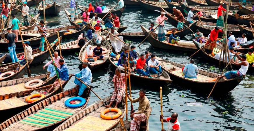Boats are seen carrying passengers to cross the Buriganga river in Dhaka, Bangladesh, February 16, 2021. REUTERSpix