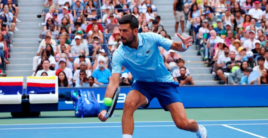 Serbia’s Novak Djokovic in action with Serbia’s Olga Danilovic during their round of 16 mixed doubles match against Russia’s Mirra Andreeva and Russia’s Daniil Medvedev REUTERS/Mike Segar