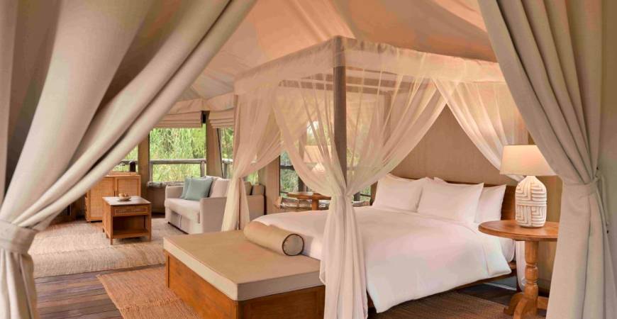 Tantawan Tented Camp features 10 spacious safari-style tents – from two-bedroom family options to a romantic one-bedroom suite – each with a private bathroom, handcrafted teak furnishings, and modern comforts designed in harmony with nature.